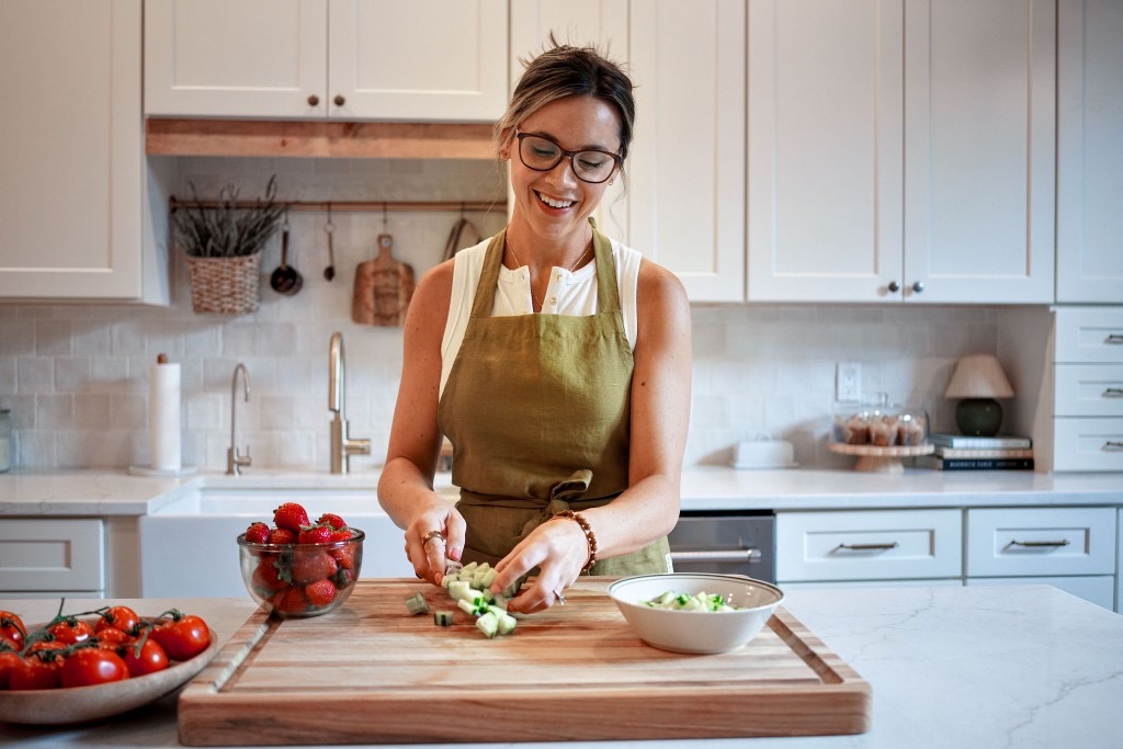 Courtney preparing fresh ingredients in her kitchen